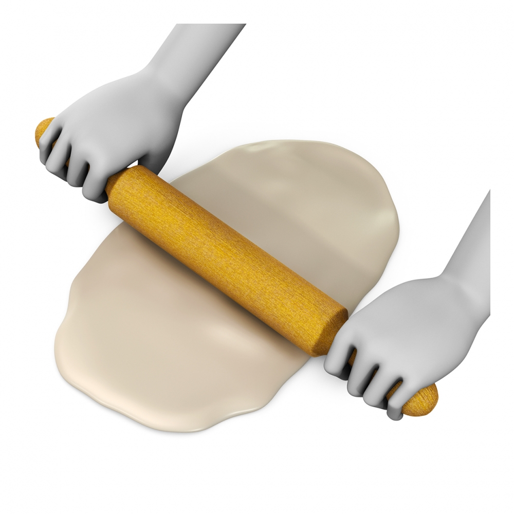 Imagen en la que se ven unas manos amasando una masa con rodillo