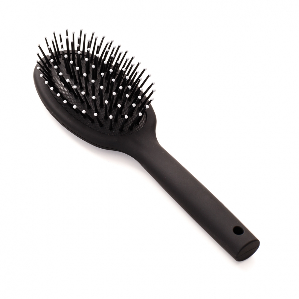 Imagen en la que se ve un cepillo de pelo