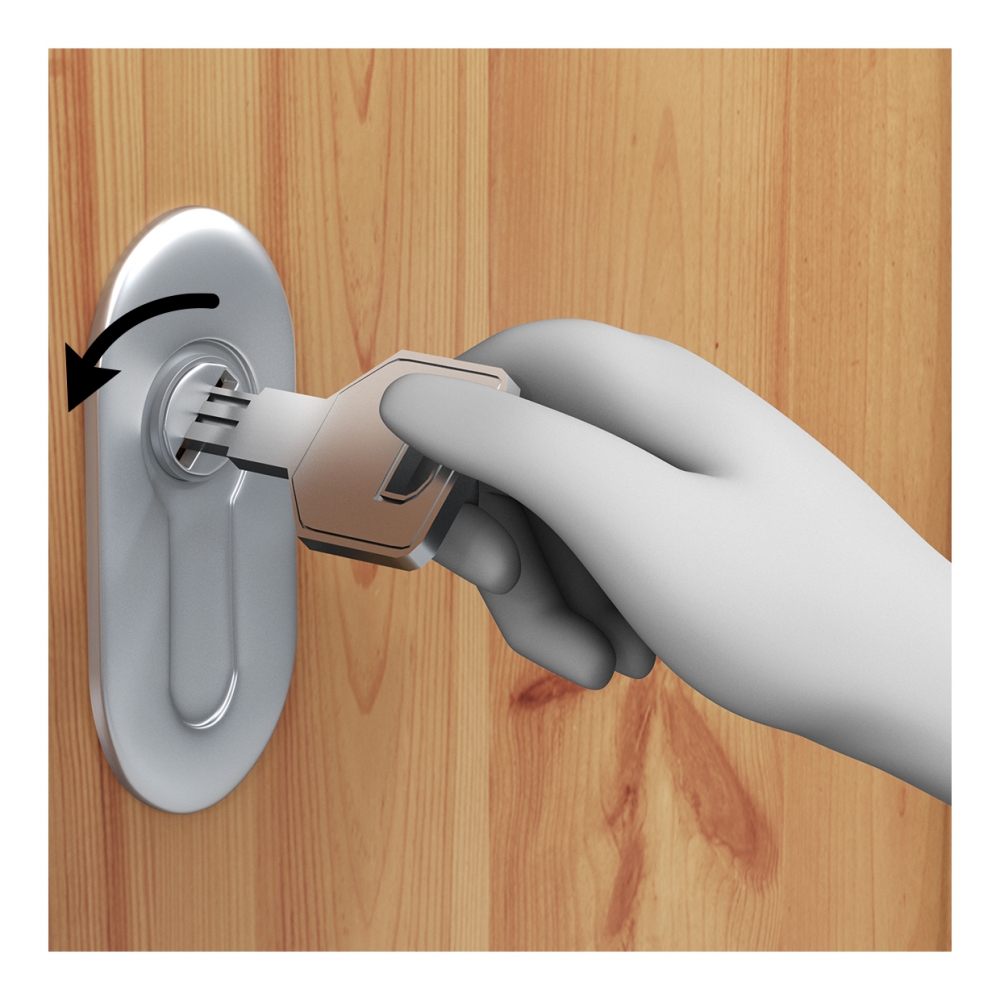 Una mano cierra una cerradura con una llave