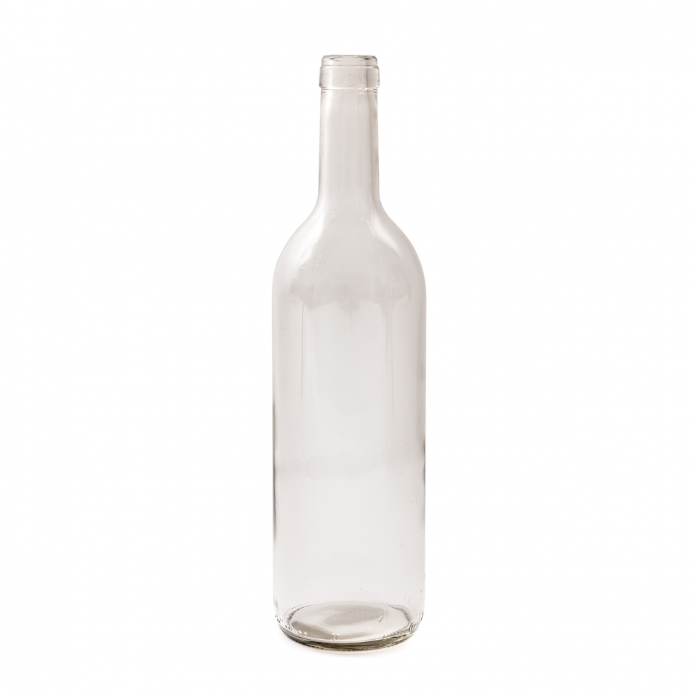 Imagen en la que se ve una botella de cristal blanco vacía