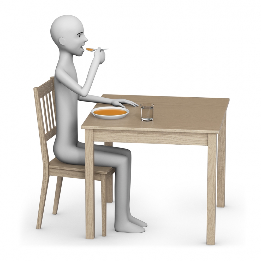 Una persona come sentada en una mesa