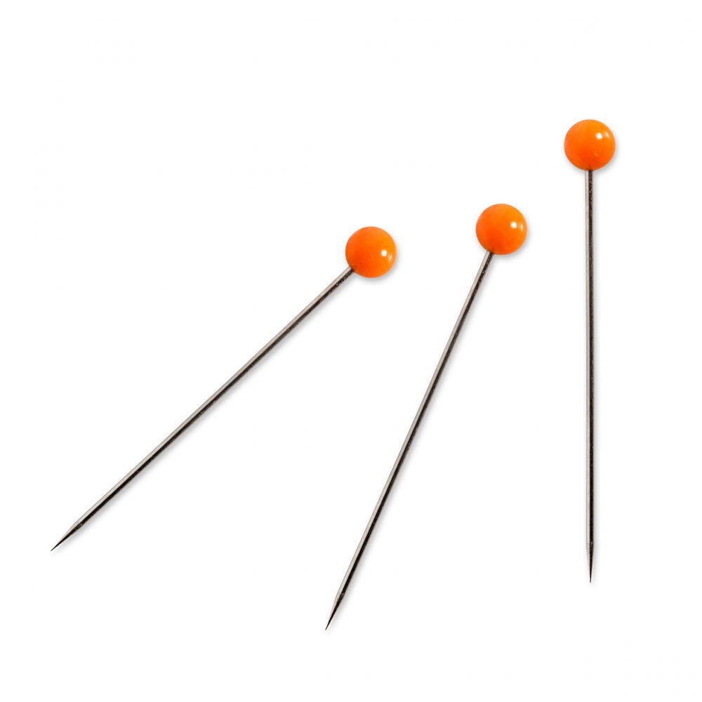 Imagen en la que se ven unos alfileres