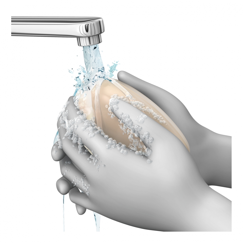 Imagen en la que se ven unas manos lavándose con agua y jabón bajo el grifo