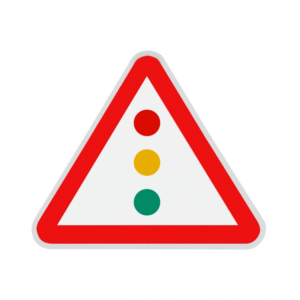 Imagen en la que se ve una señal de precaución por semáforo