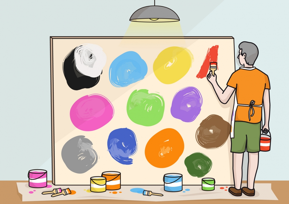 Imagen en la que una persona está pintando con colores en un lienzo