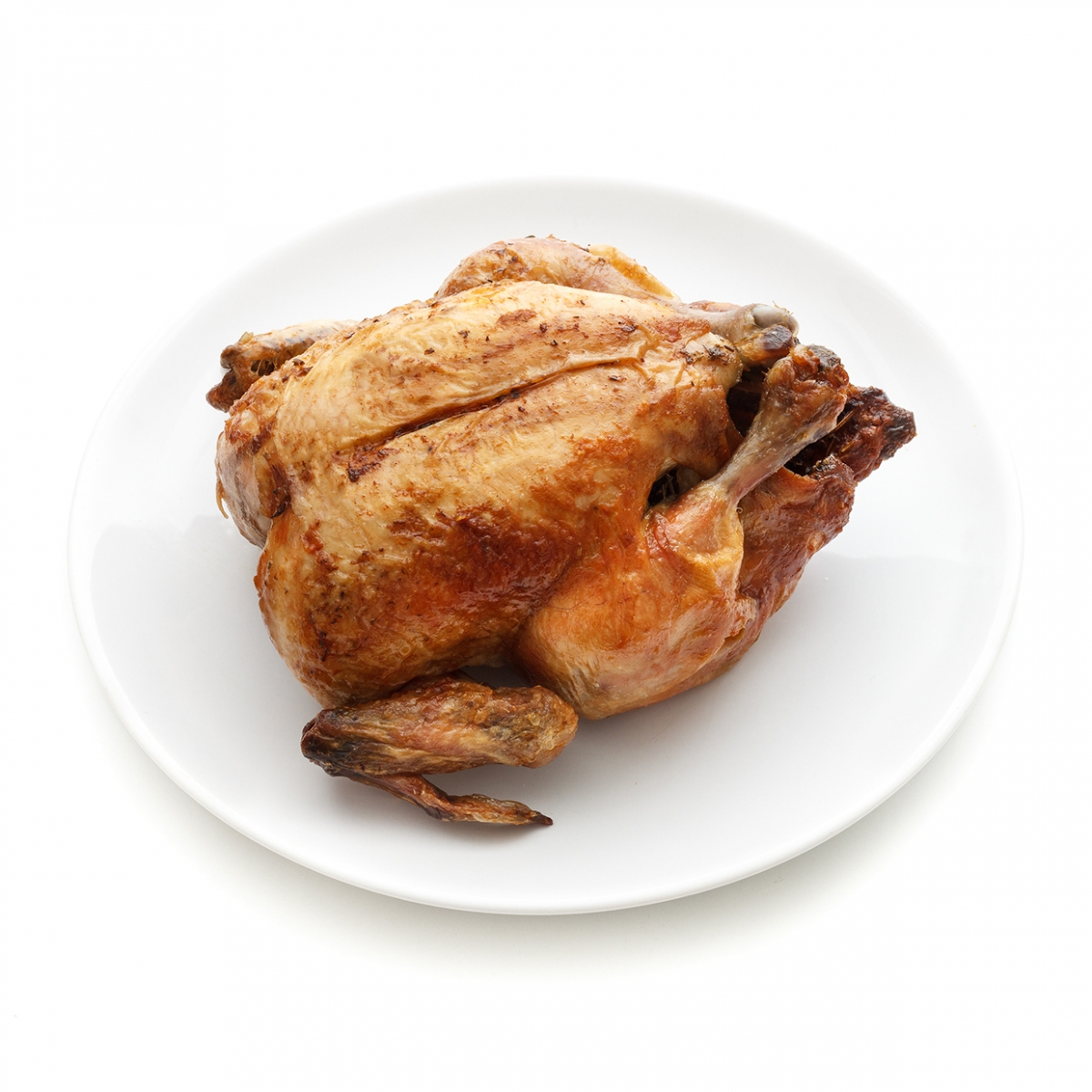 Imagen en la que se ve un pollo asado sobre un plato