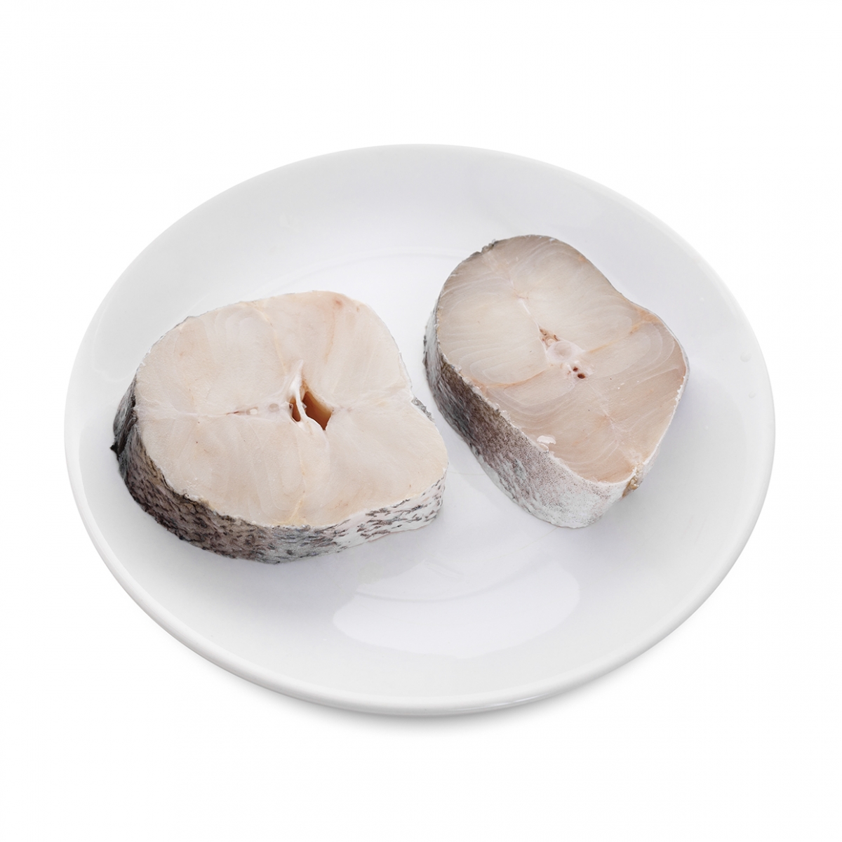 Imagen en la que se ve un plato con dos rodajas de merluza