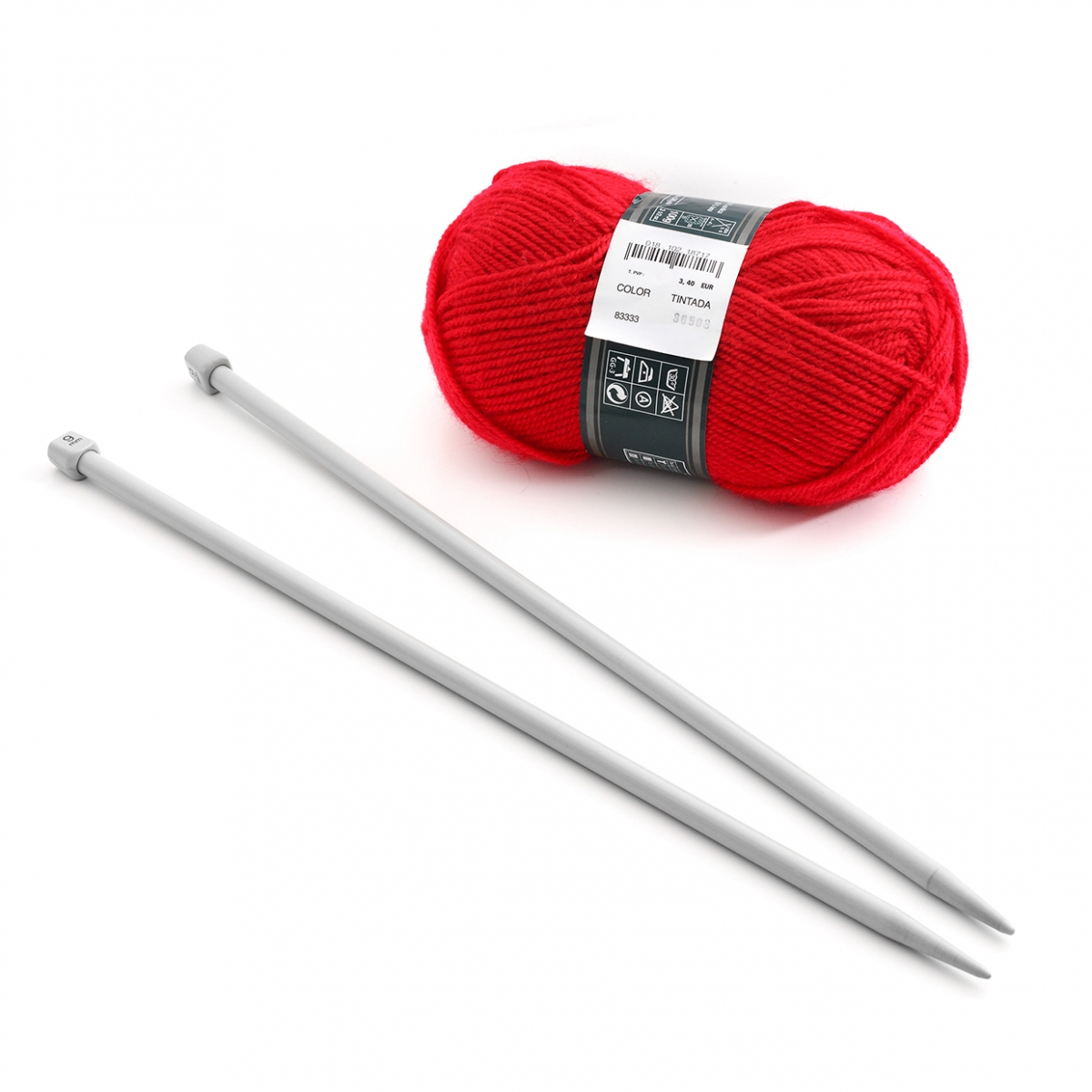 Imagen en la que se ven un par de agujas y un ovillo de lana