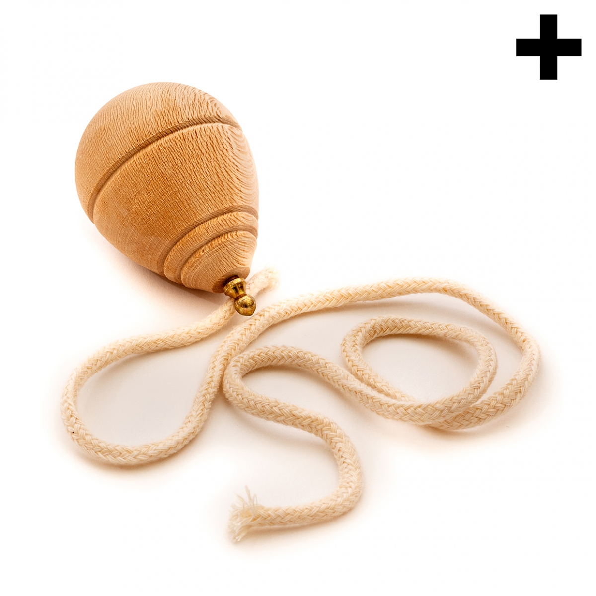 Imagen en la que se ve una peonza de madera