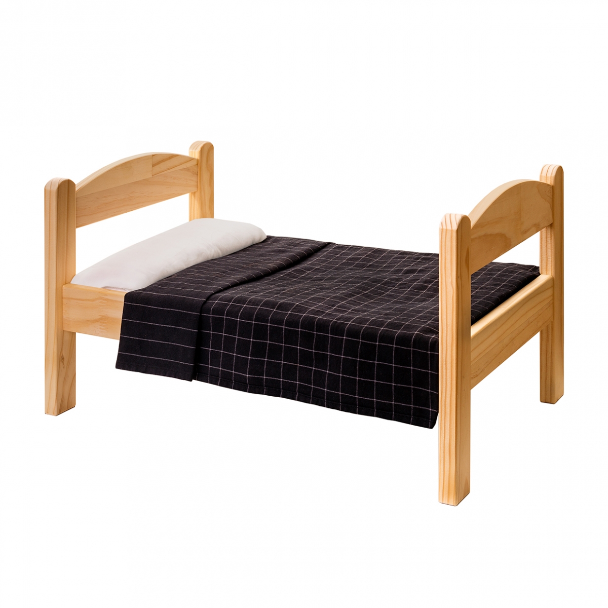 Imagen en la que se ve una cama de madera individual