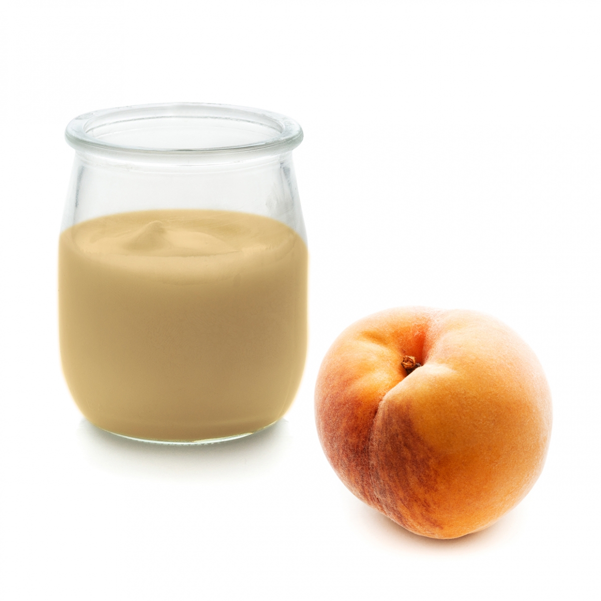 Imagen en la que se ve un yogur de melocotón