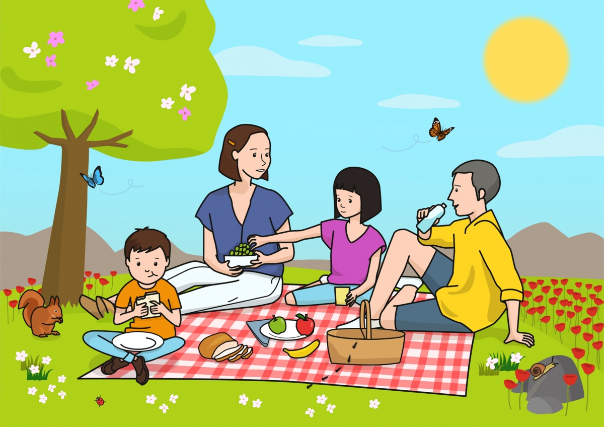 La familia está haciendo un pícnic en el campo