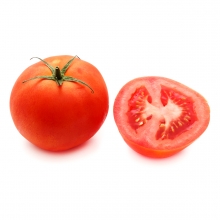 Imagen en la que se ve un tomate entero y a su derecha medio