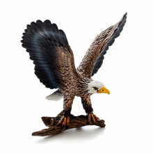 Imagen en la que se ve un águila posada sobre una rama