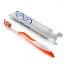 Imagen en la que se ve un cepillo de dientes y un dentífrico