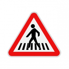 Imagen en la que se ve una señal de precaución por paso de peatones