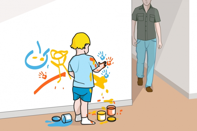 El bebé pinta la pared con pintura de dedos