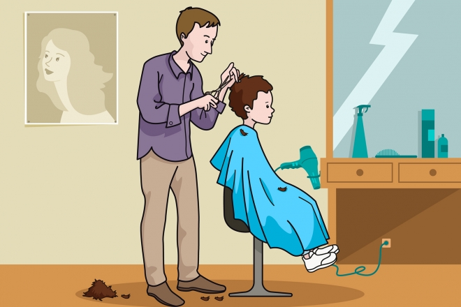 El peluquero corta el pelo al niño